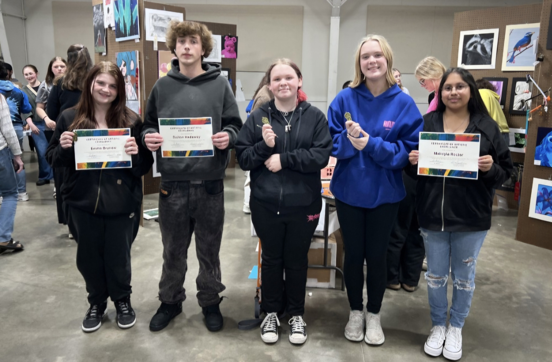 The LCHS award-winning students at the Hawkeye 10 Art Show.