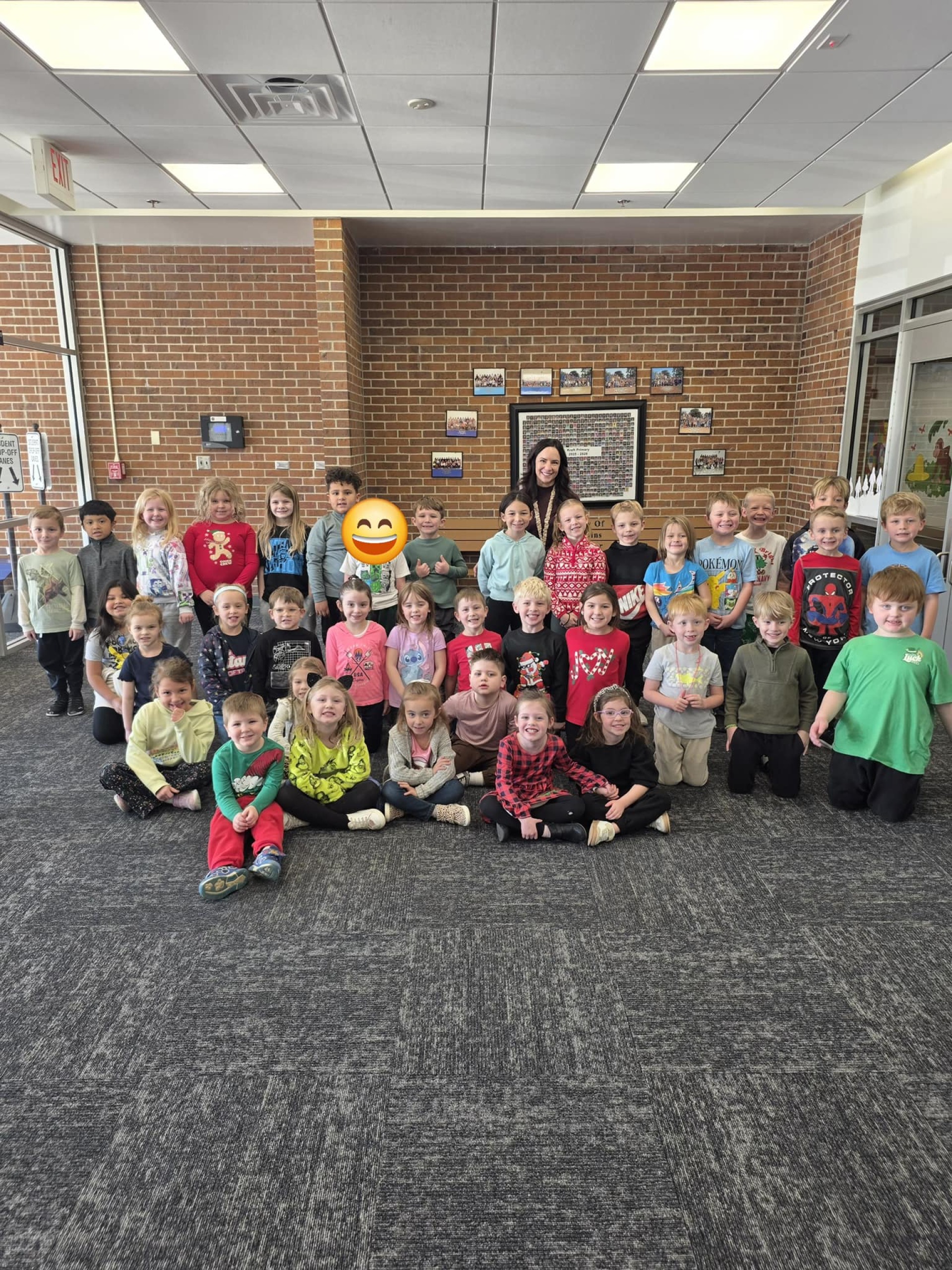 A group of Kreft students posing with their assistant principal to celebrating being the "Titan of the Month" in December.