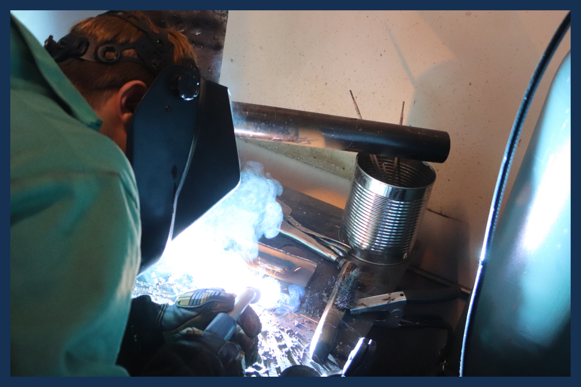 High school student welding.