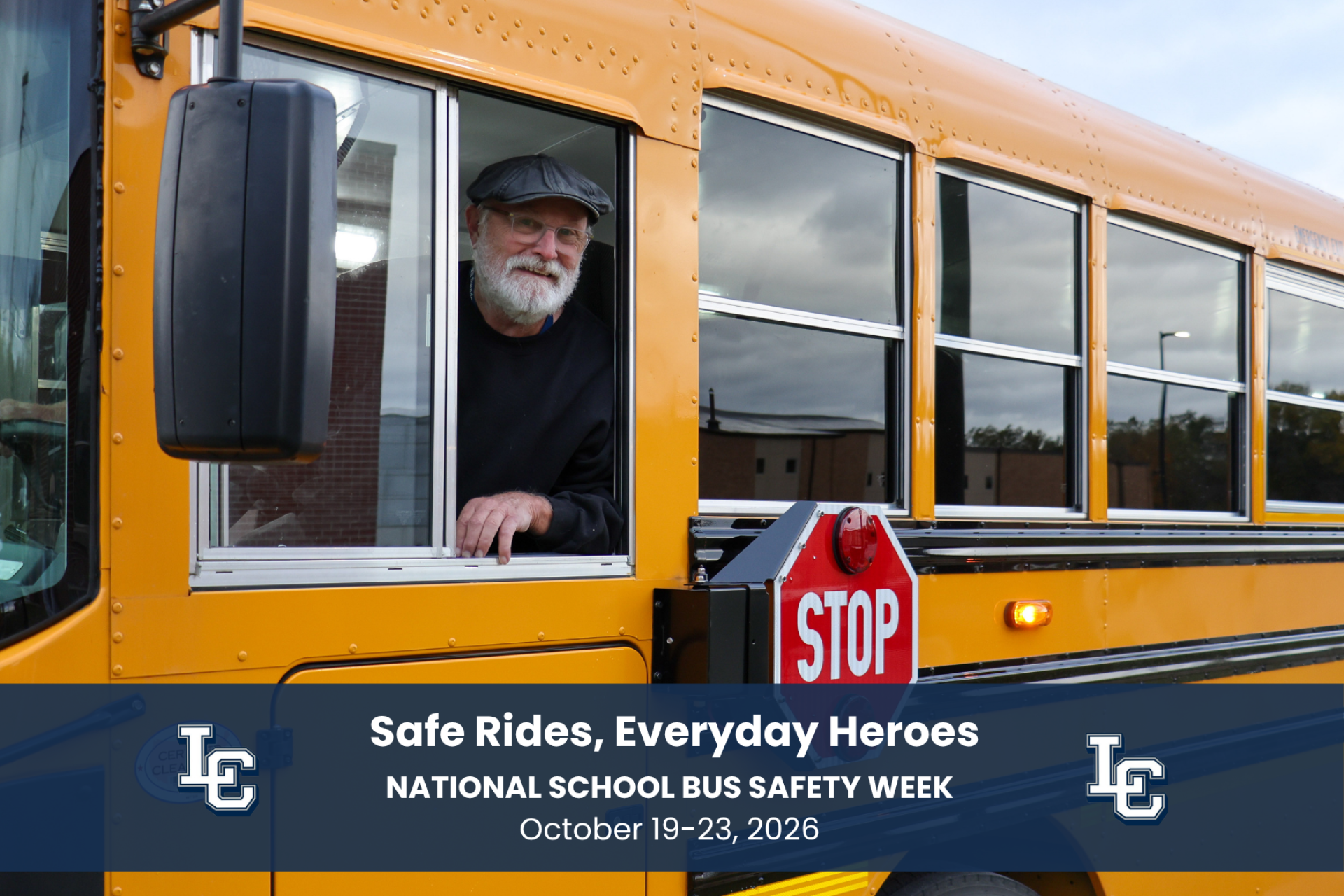 A school bus driver looking out the bus window.