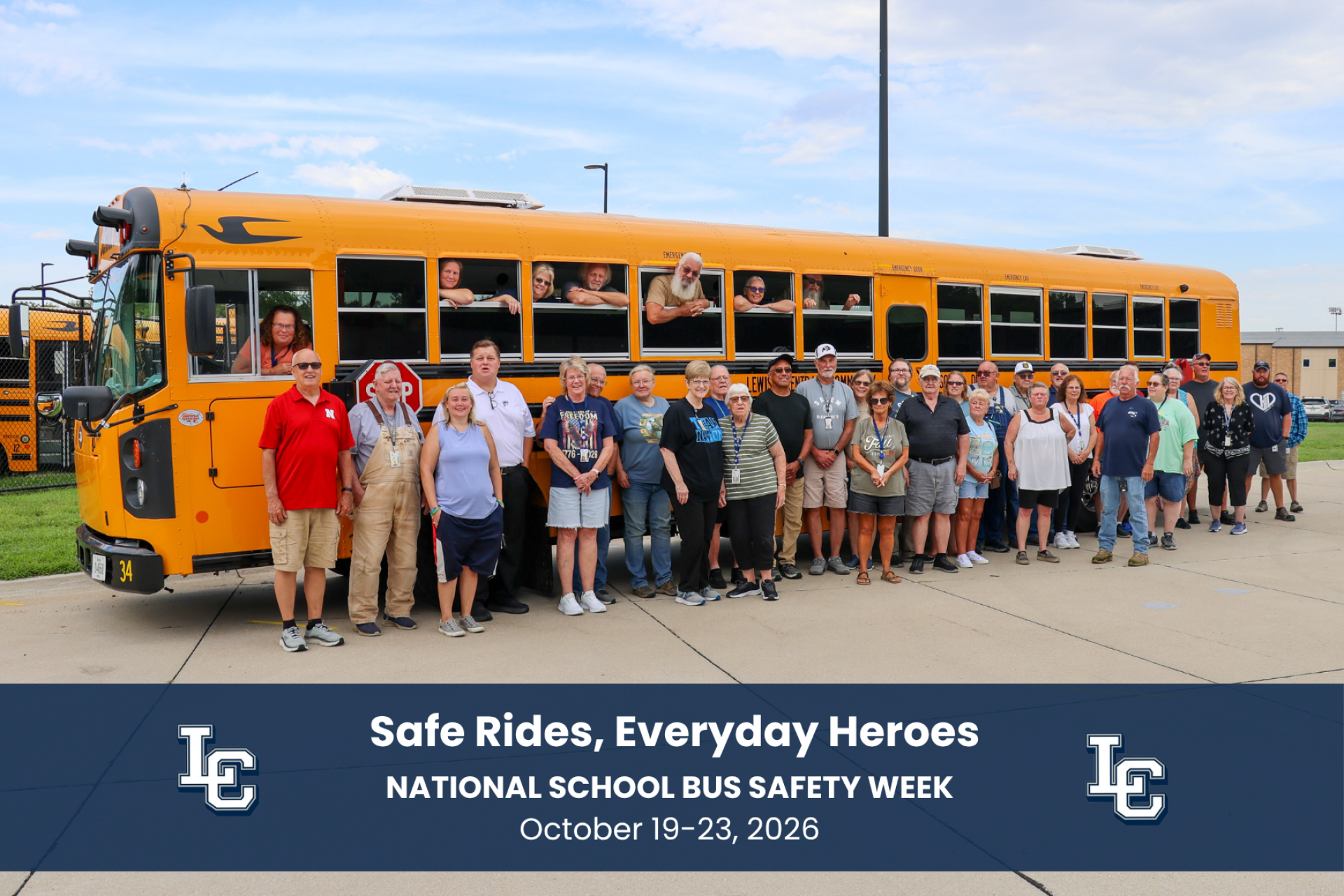 The Lewis Central transportation department standing in front of a bus.