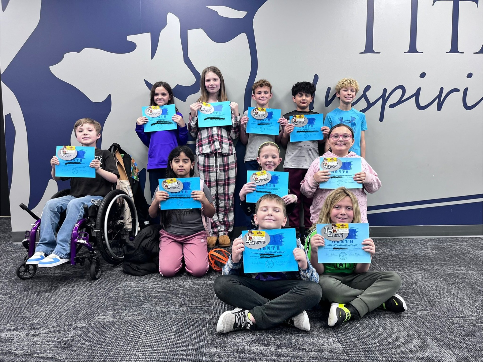 A group of students who were named the Titan of the Month.