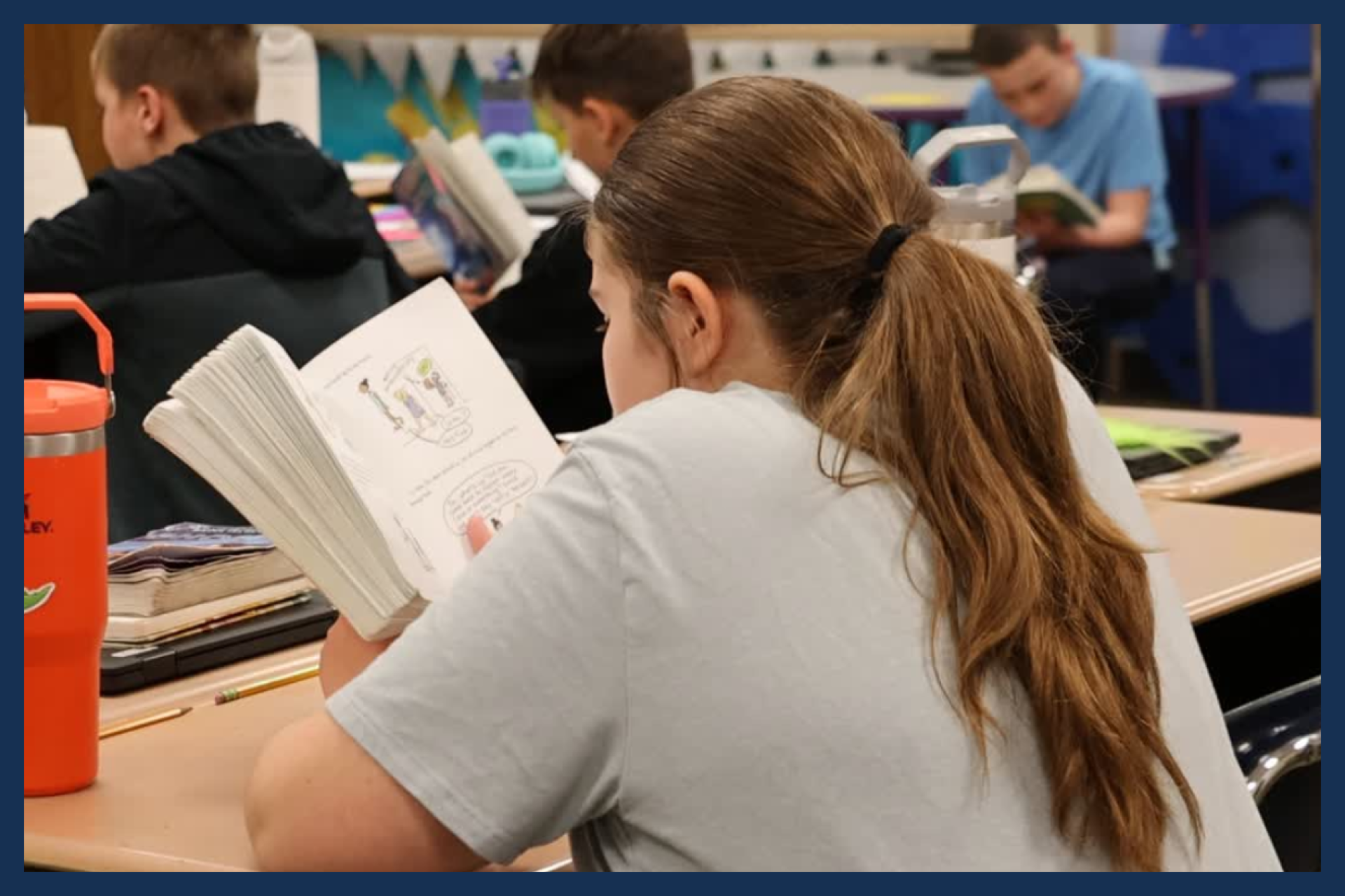 A Titan Hill student reading a chapter book.
