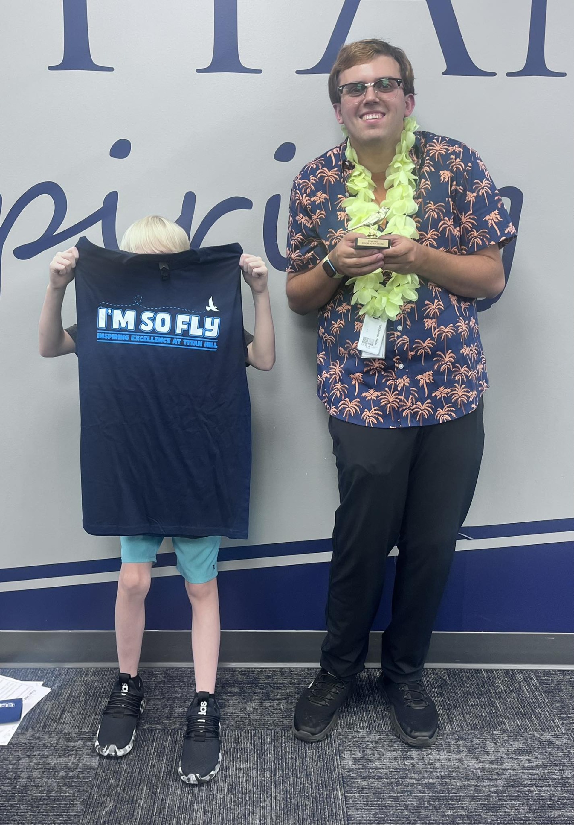 Noah Whitesel holding his "Youre so Fly" award