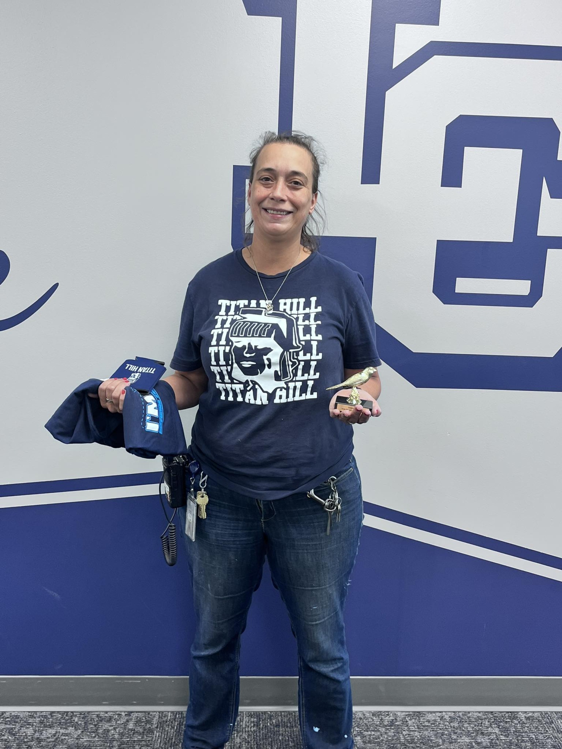 Annie Barnes holding her "Youre so Fly" award