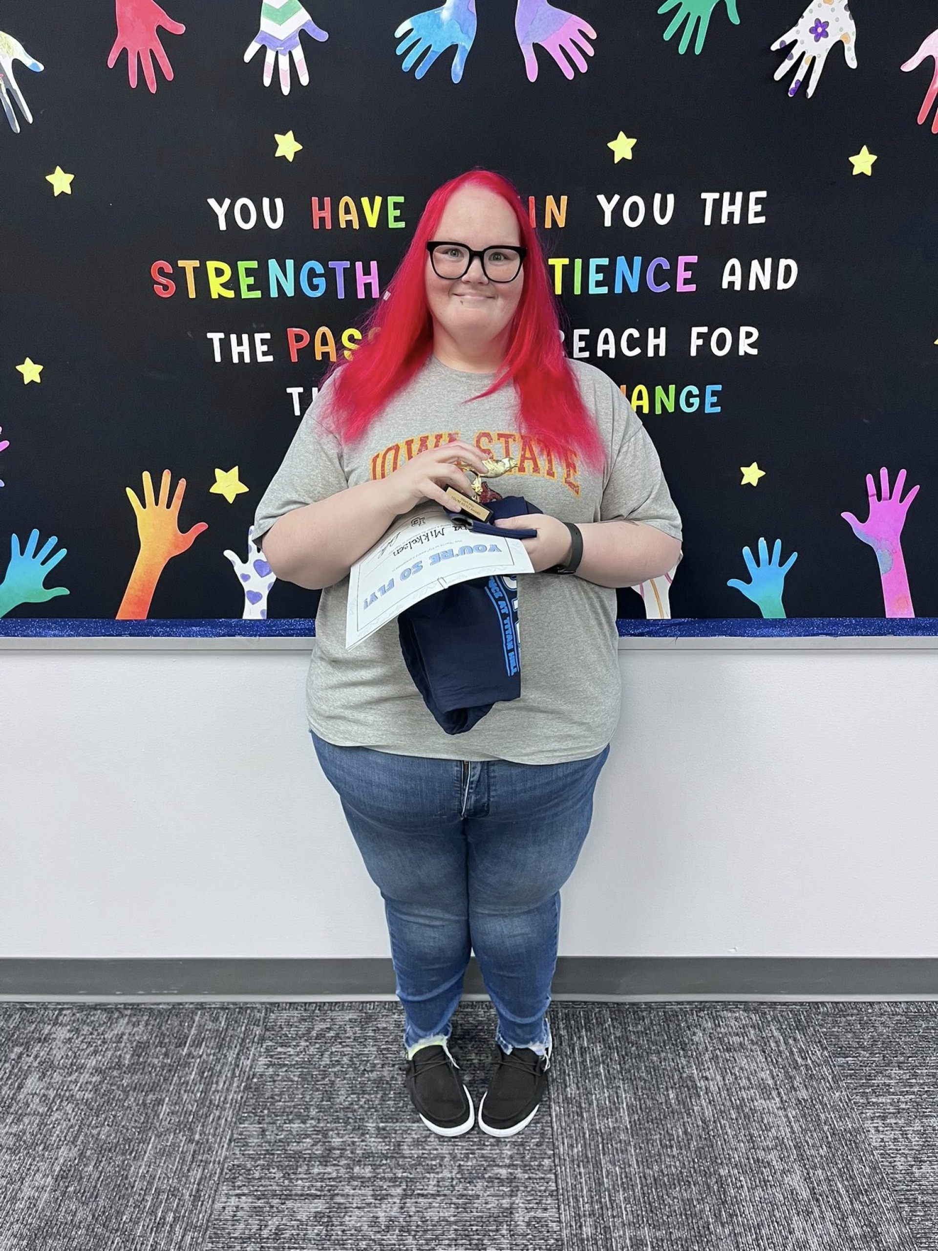 Miss Mikkelsen with her youre so fly staff award.